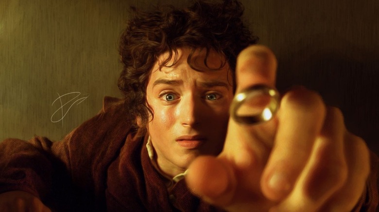 Frodo reaches up for the One Ring