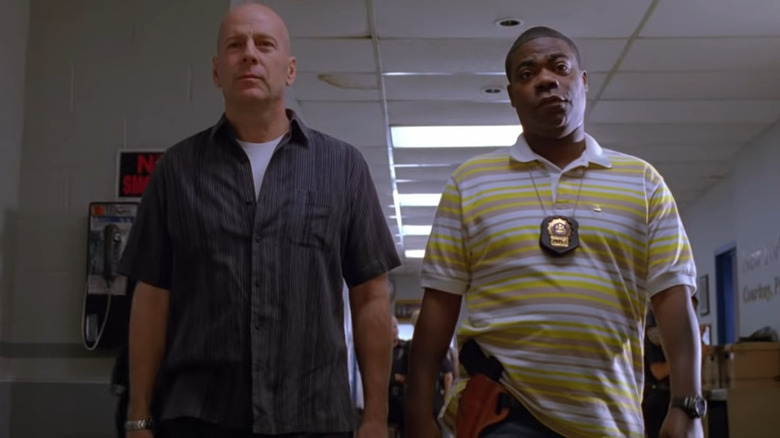 Tracy Morgan and Bruce Willis walking down hallway