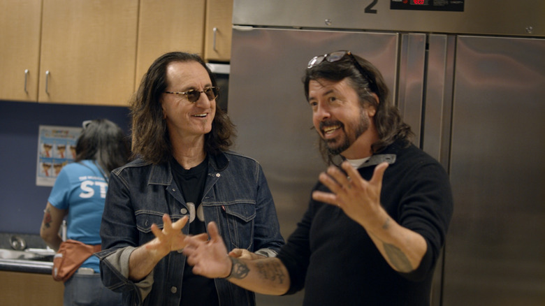 Geddy Lee and Dave Grohl smiling