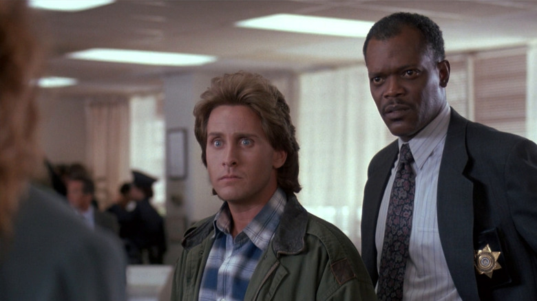 Holt and Luger stare intently at a woman in "Loaded Weapon 1" (1991)