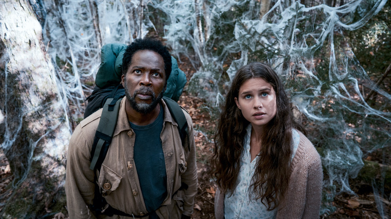 Boyd and Sara standing among the spiderwebs