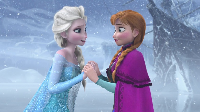 Anna and Elsa holding hands