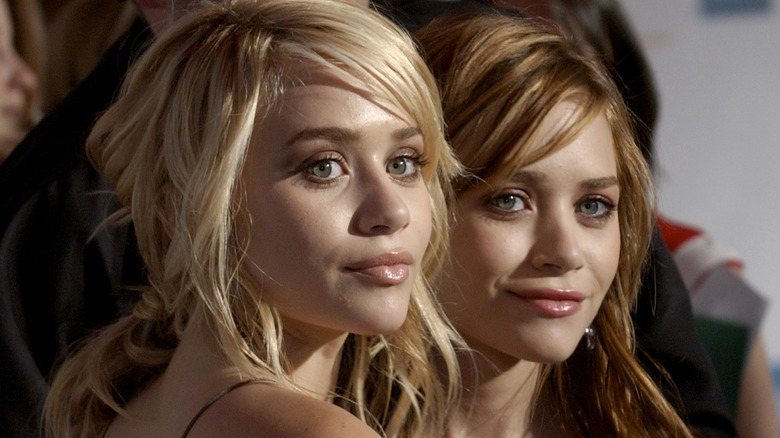 Mary-Kate and Ashley Olsen smiling 