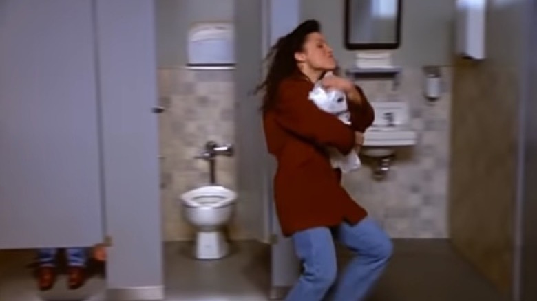 elaine running with toilet paper