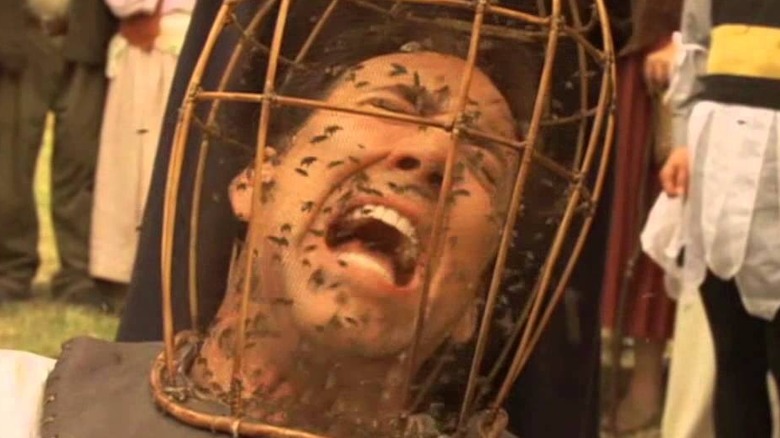 Officer Malus covered in bees, screaming