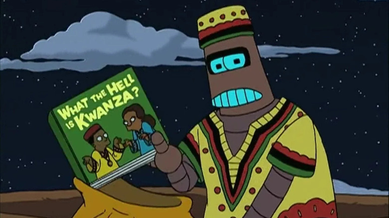 Kwanzaabot holds the book "What the Hell Is Kwanza?"