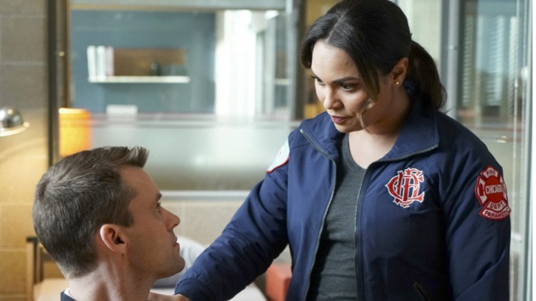 Monica Raymond and Jesse Spencer in firehouse