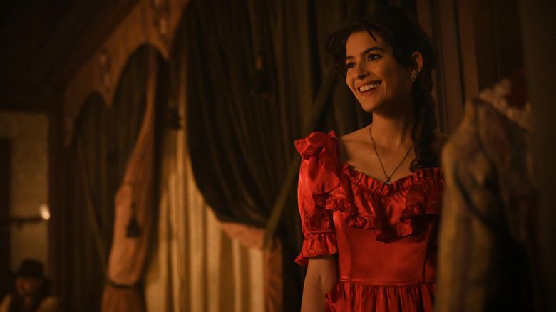 Lucia smiling in red dress in Walker Independence