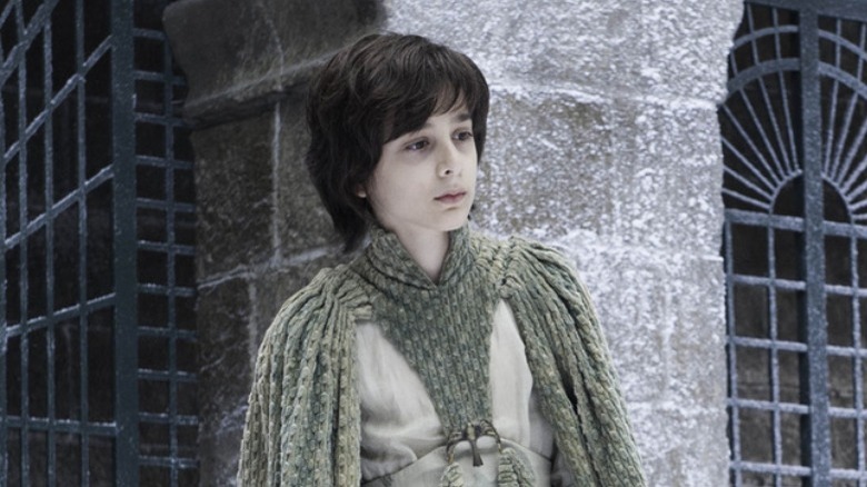 Robin Arryn stands in the snow