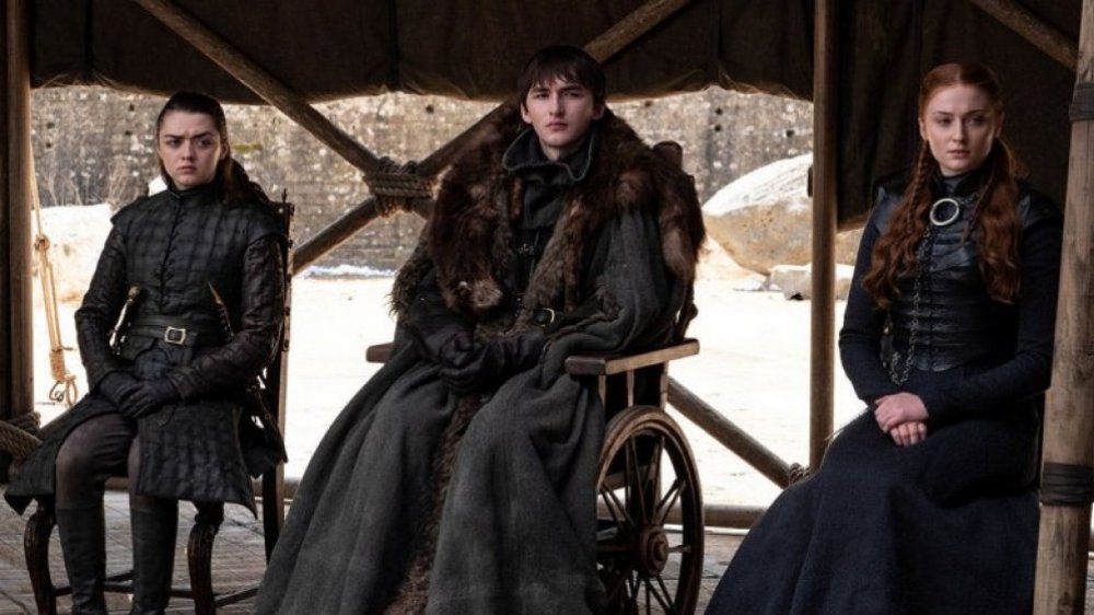 Isaac Hempstead Wright as Bran Stark, alongside Sophie Turner as Sansa Stark and Maisie Williams as Arya Stark, on Game of Thrones