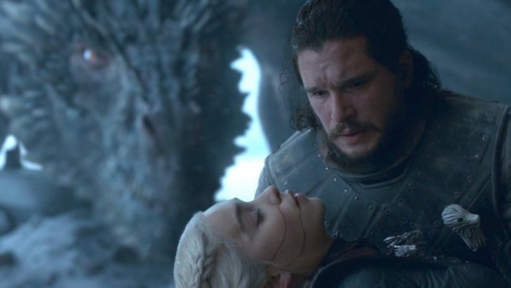 Emilia Clarke as Daenerys Targaryen, dead in the arms of Kit Harington as Jon Snow, on Game of Thrones