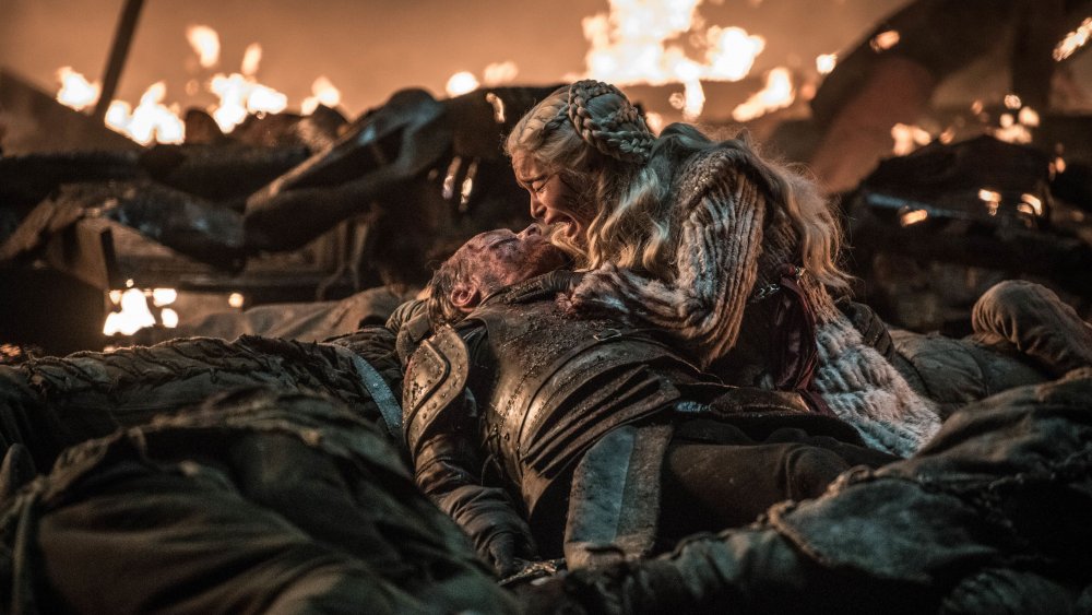 Emilia Clarke as Daenerys Targaryen, weeping over the body of Iain Glen as Jorah Mormont, on Game of Thrones