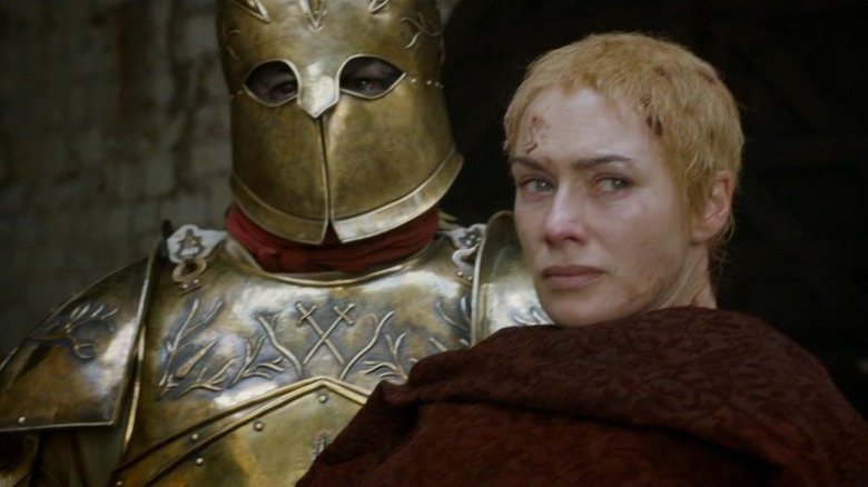 Cersei Lannister being carried by a guard