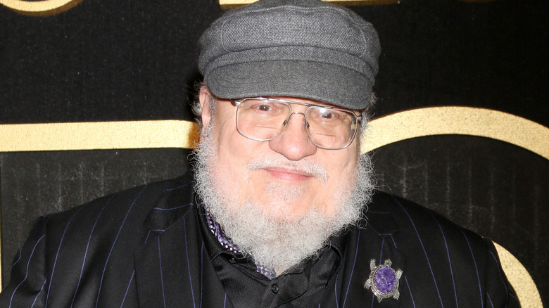 George R.R. Martin smiles at an event