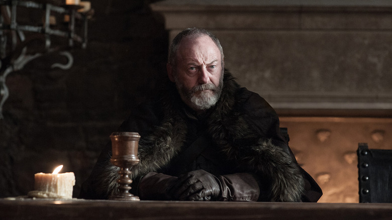 Davos sitting at table in Season 7 