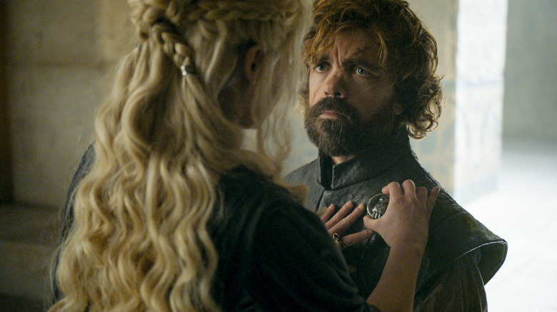 Daenerys pinning Hand of the King pin on Tyrion