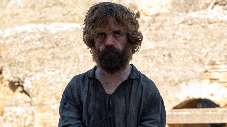 Tyrion dirty in chains frowning beard