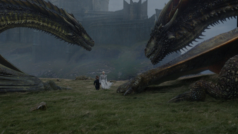 Daenerys and Tyrion walking towards dragon