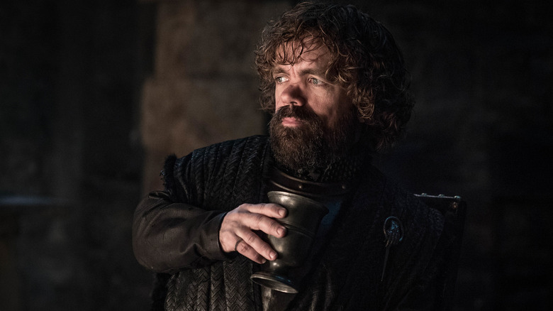 Tyrion holding cup