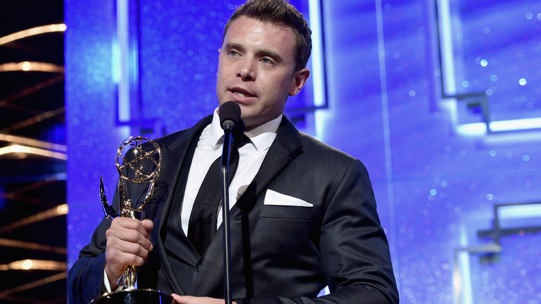 Billy Miller holds an Emmy