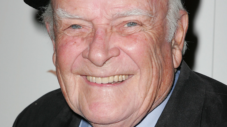 John Ingle smiling at camera