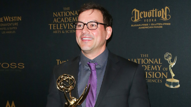 Tyler Christopher holding an Emmy