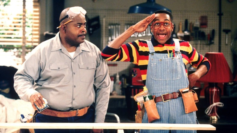 Carl and Urkel sanding wood