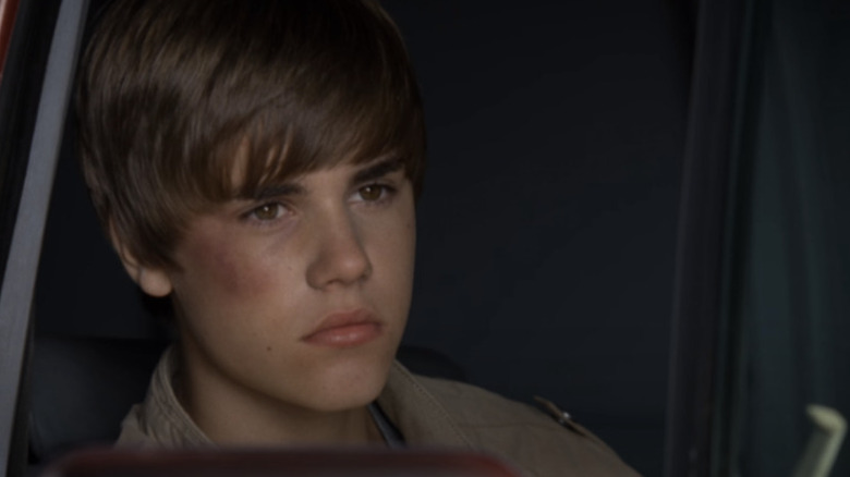 Justin Bieber sitting in a van for CSI