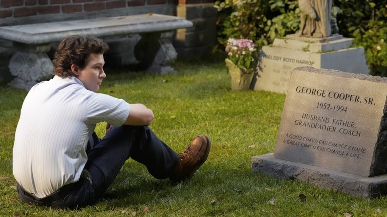 Georgie Cooper sits beside his father's grave on Georgie & Mandy's First Marriage