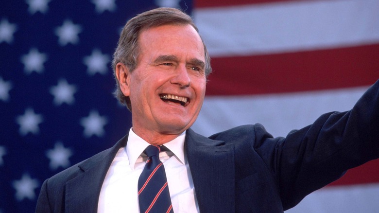 George HW Bush waving to crowd