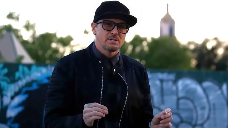 Zak Bagans talking with hands wearing all black