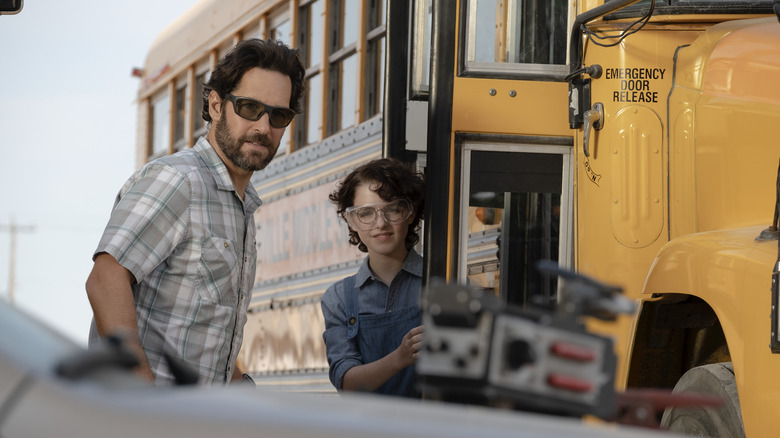 Mr. Grooberson and Phoebe near a bus