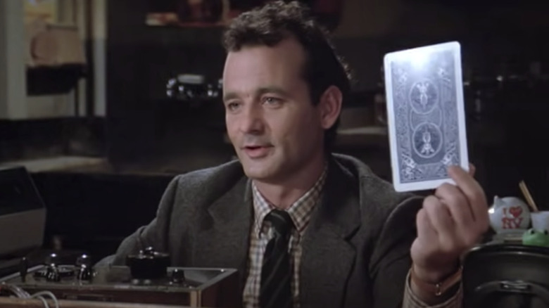 Venkman holding a card