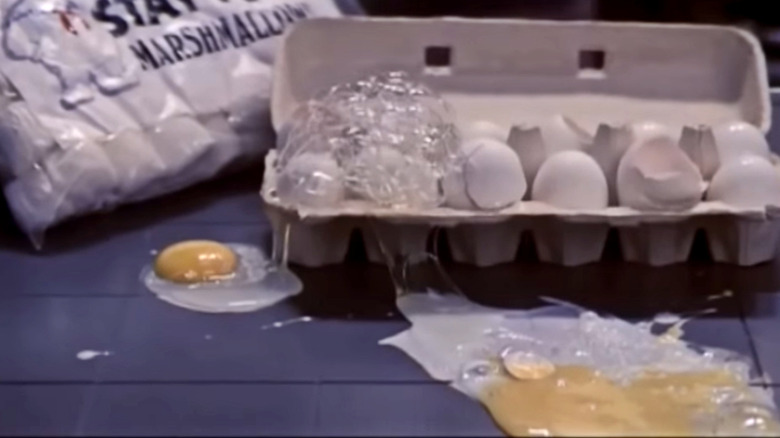 Eggs leaping out of carton