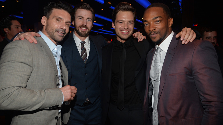 Frank Grillo, Chris Evans, Sebastian Stan, and Anthony Mackie posing and smiling together