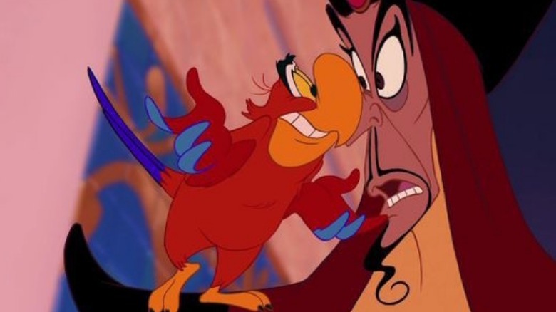 Iago standing on Jafar's nose