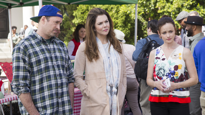 Luke, Lorelai, and Rory look perplexed