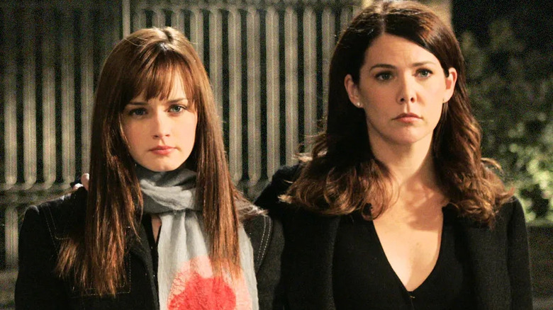 Lorelai and Rory standing looking serious