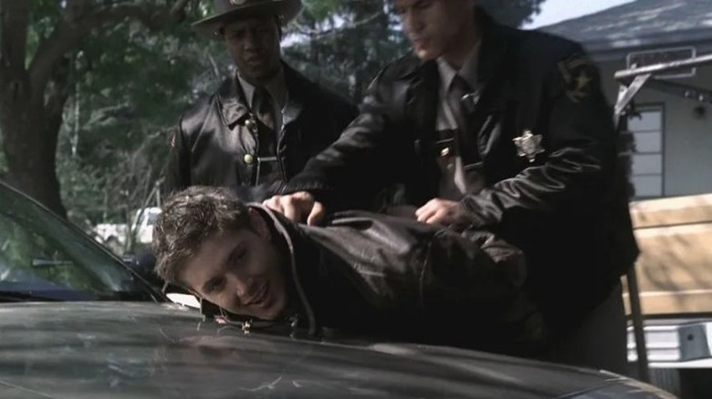 Dean is apprehended by cops