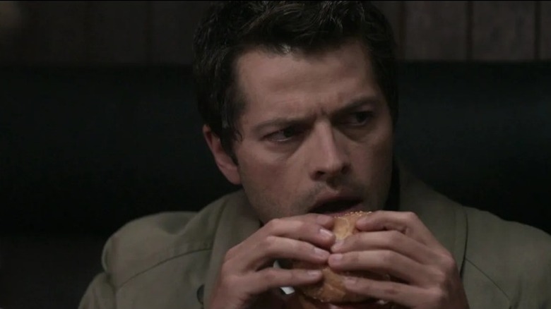 Castiel eats a burger