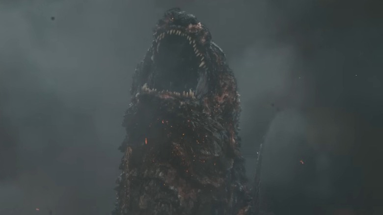 Godzilla roaring in cloud of smoke