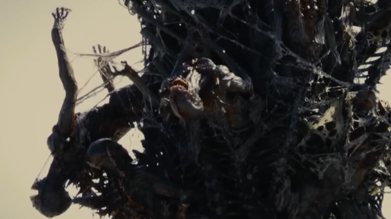 Humanoid creatures on Shin Godzilla's tail