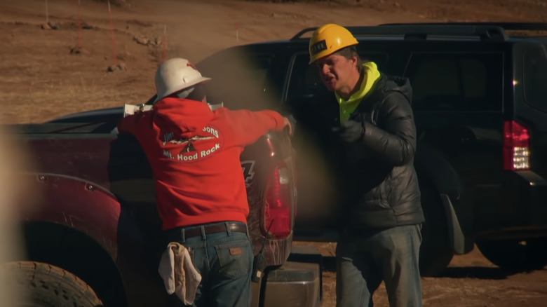 Dave Turin talking with a worker