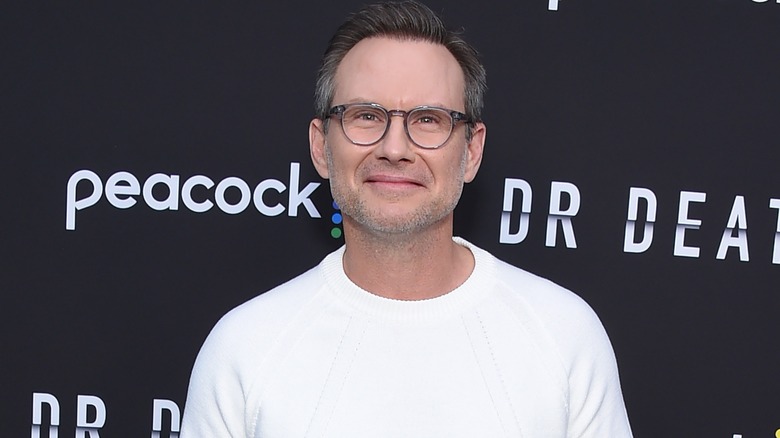 Christian Slater in white shirt