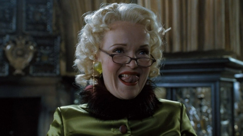 Rita Skeeter licking her teeth