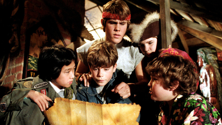 The cast of The Goonies study One-Eyed Willy's map