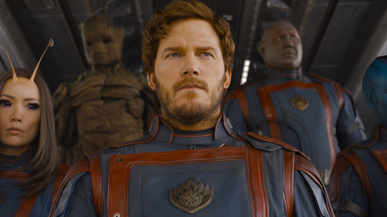 Peter Quill flanked by Guardians