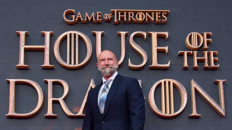 Graham McTavish in front of the House of the Dragon sign