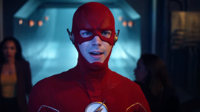 Flash standing in front of his family 