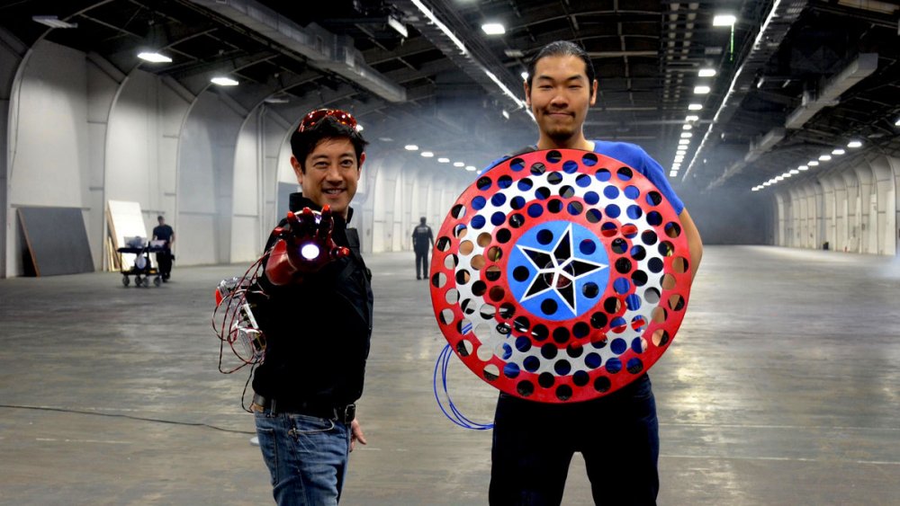 Grant Imahara with Iron Man's gauntlet and Allen Pan with Captain America's shield